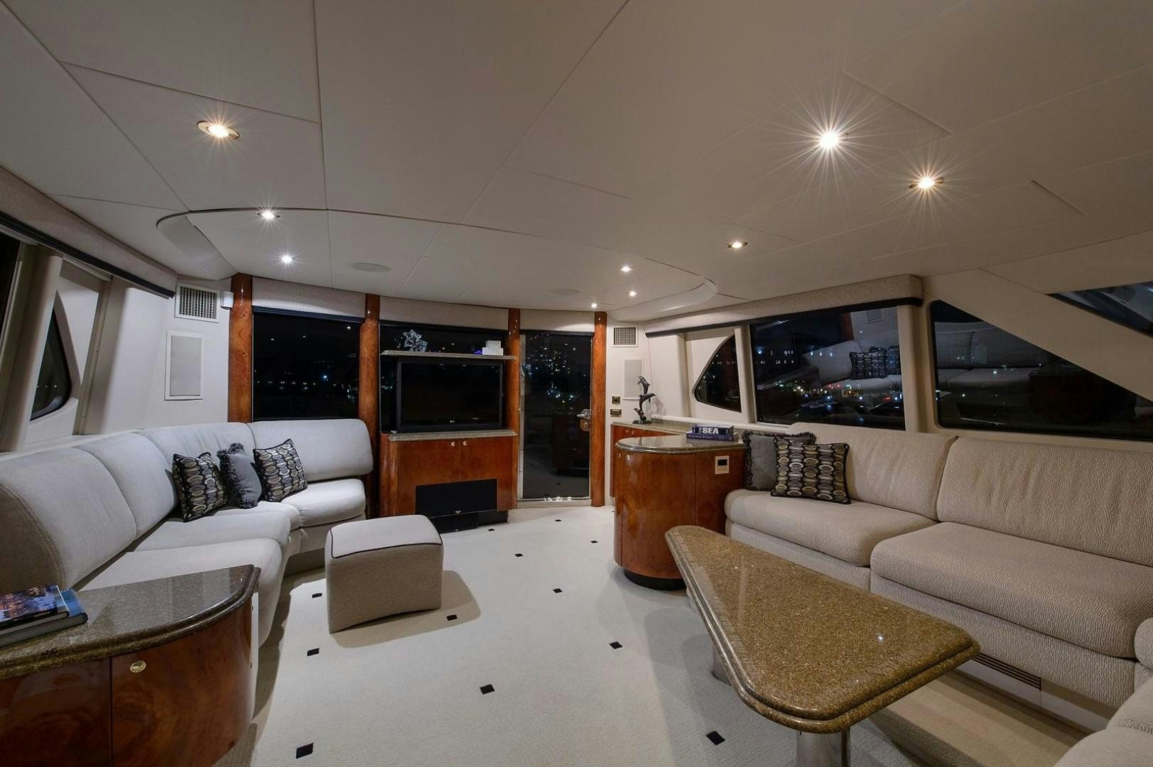 a living room with a fireplace aboard BIG WAVE Yacht for Sale