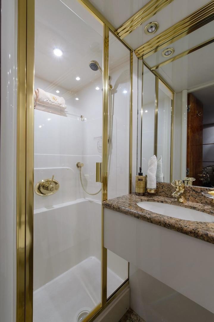 a bathroom with a sink and a bathtub aboard BIG WAVE Yacht for Sale