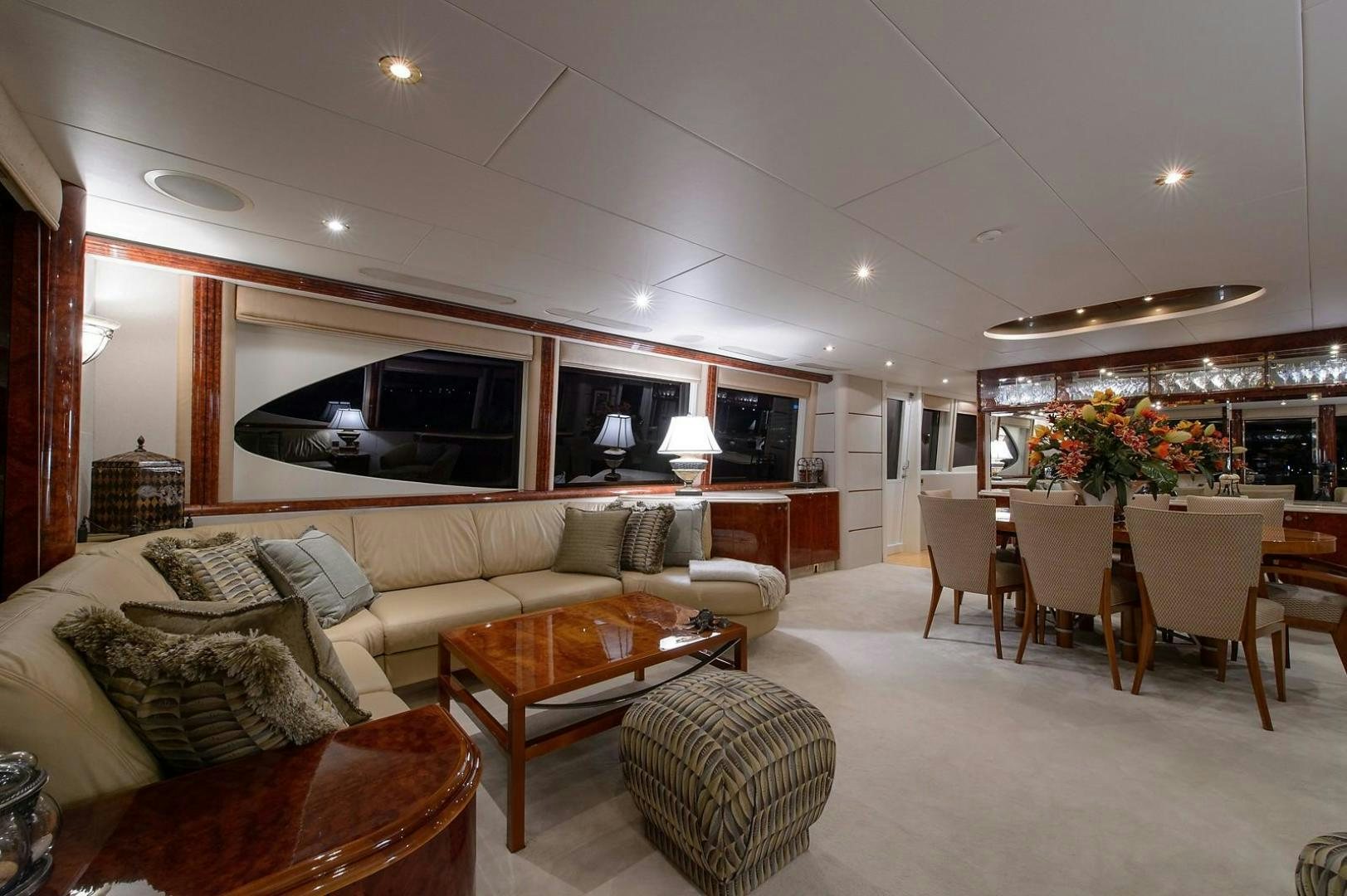 a living room with a couch and a table aboard BIG WAVE Yacht for Sale