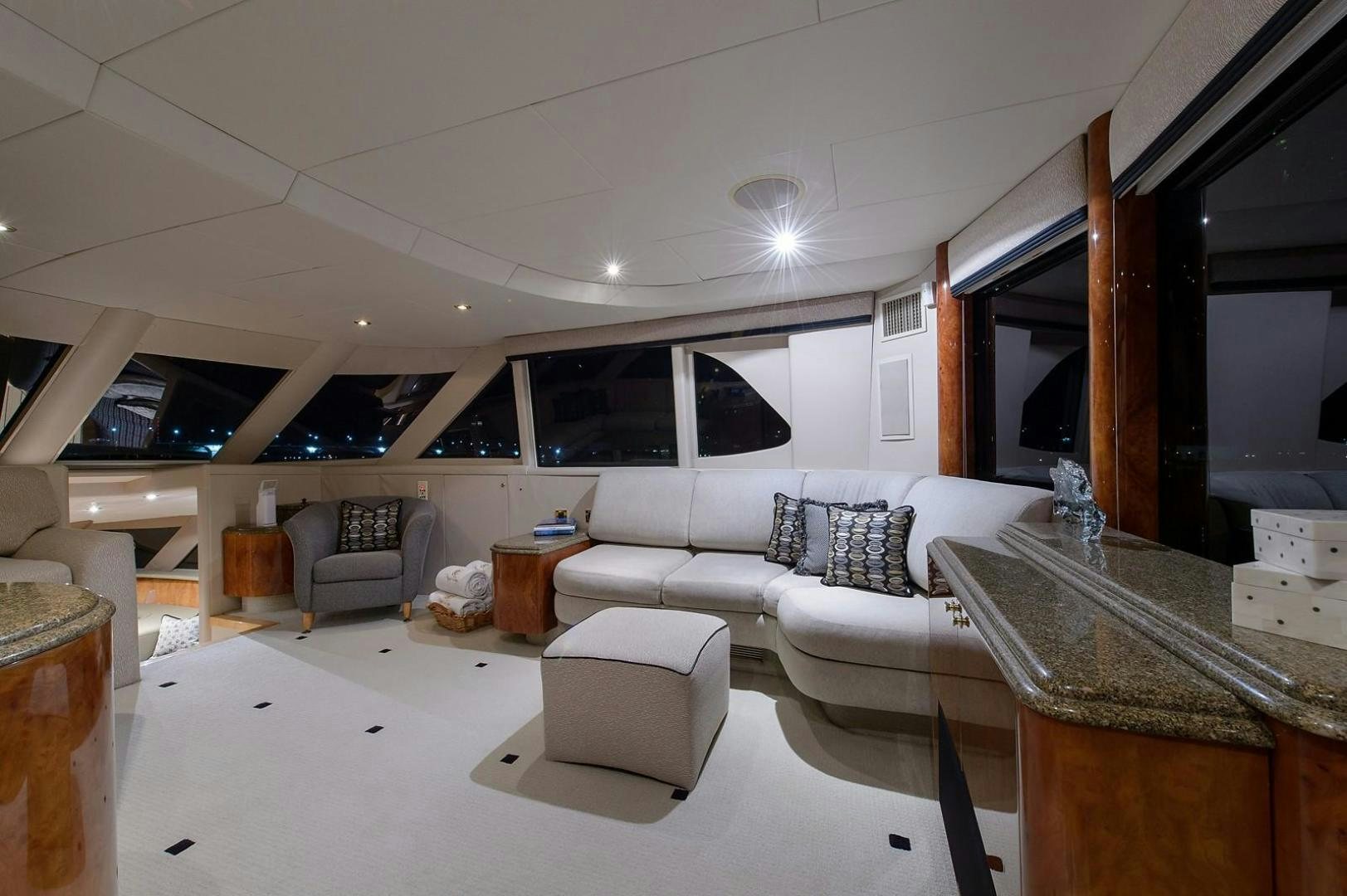 a living room with a large mirror aboard BIG WAVE Yacht for Sale