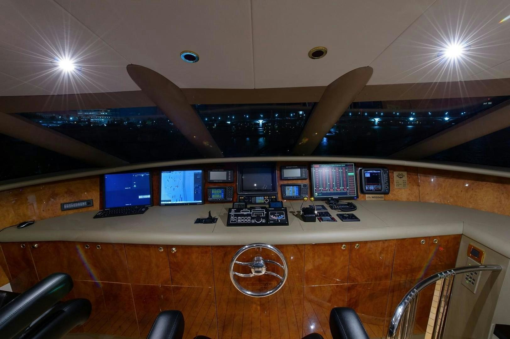 a room with computers and monitors aboard BIG WAVE Yacht for Sale