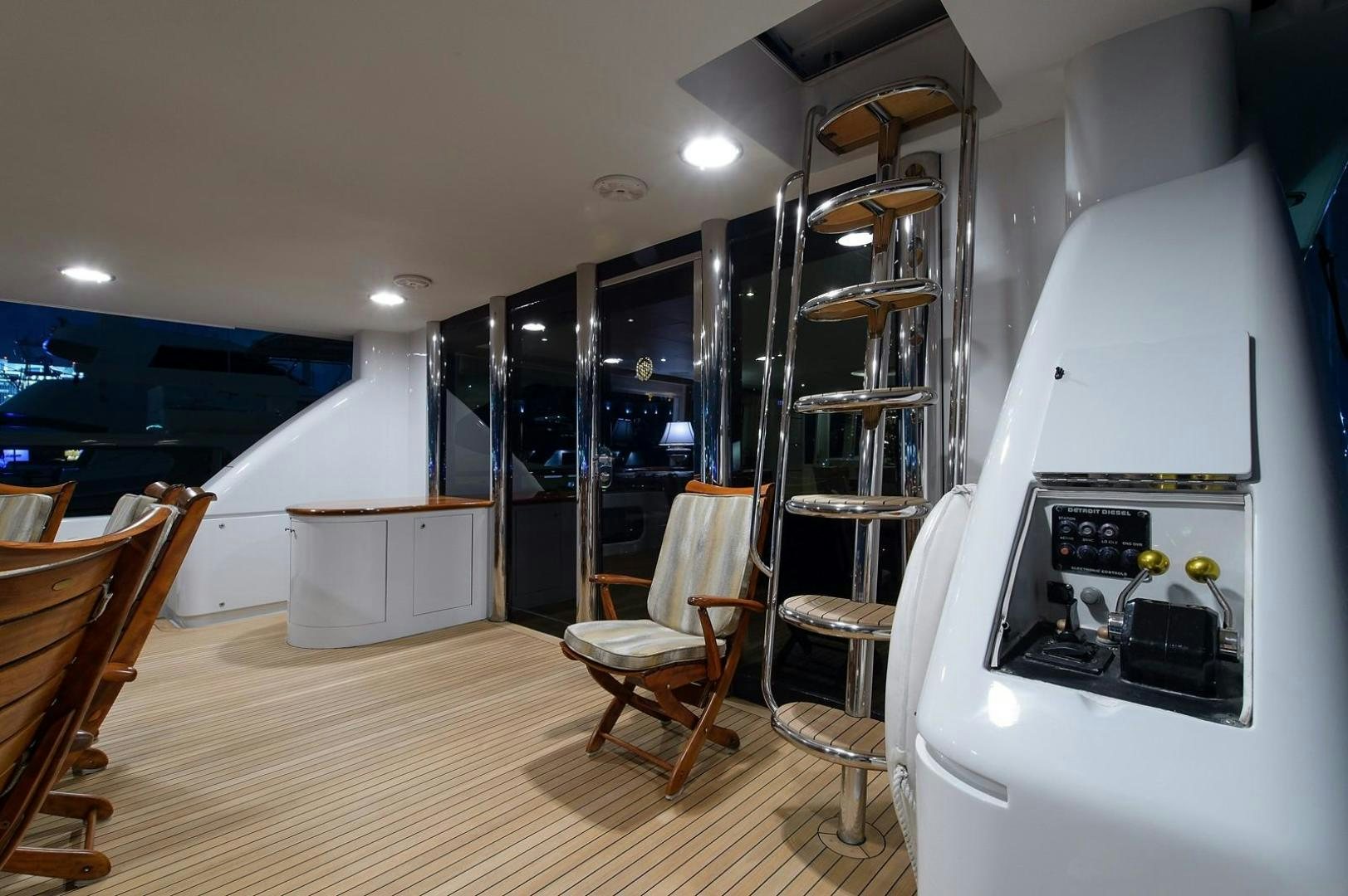 a room with a desk and chairs aboard BIG WAVE Yacht for Sale