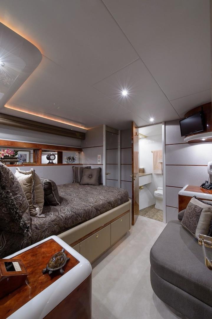 a living room with a couch and a coffee table aboard BIG WAVE Yacht for Sale