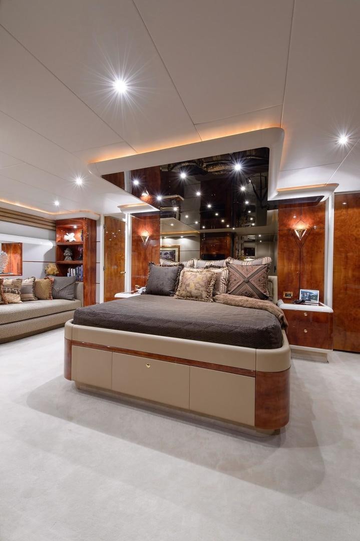 a large living room with a large mirror aboard BIG WAVE Yacht for Sale