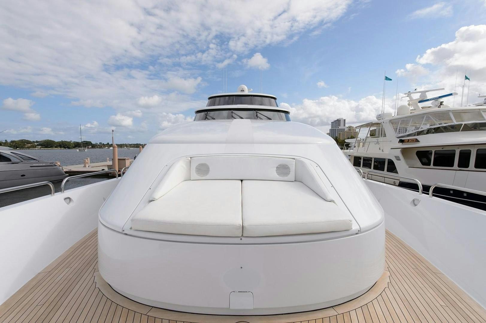 a white yacht in a dock aboard BIG WAVE Yacht for Sale