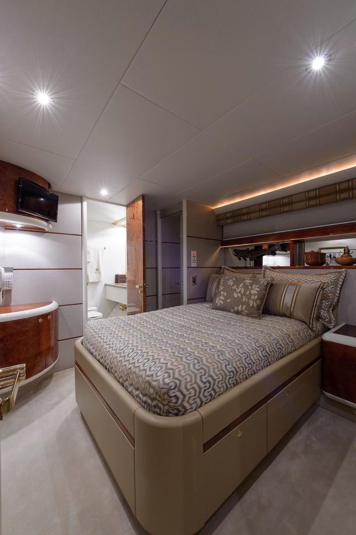 a large bed in a room aboard BIG WAVE Yacht for Sale