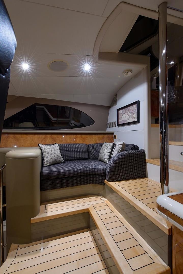 a living room with a couch aboard BIG WAVE Yacht for Sale