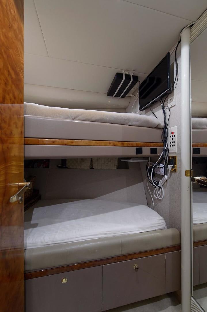 a white shelf with a computer on it aboard BIG WAVE Yacht for Sale