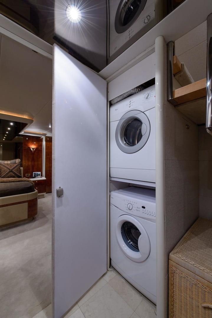 a washer and dryer in a room aboard BIG WAVE Yacht for Sale