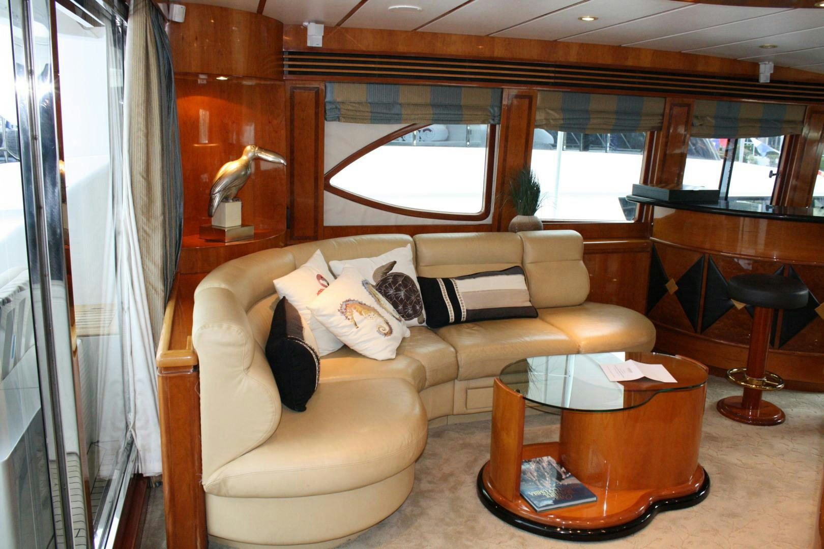 a living room with a couch and a coffee table aboard CRYSTAL ANNE Yacht for Sale