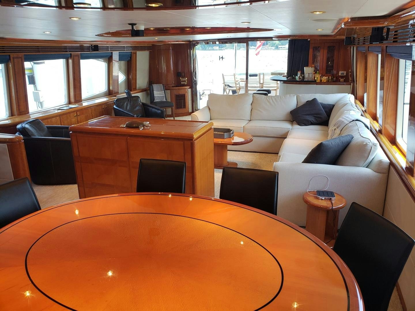 a living room with a couch and a table aboard CRYSTAL ANNE Yacht for Sale