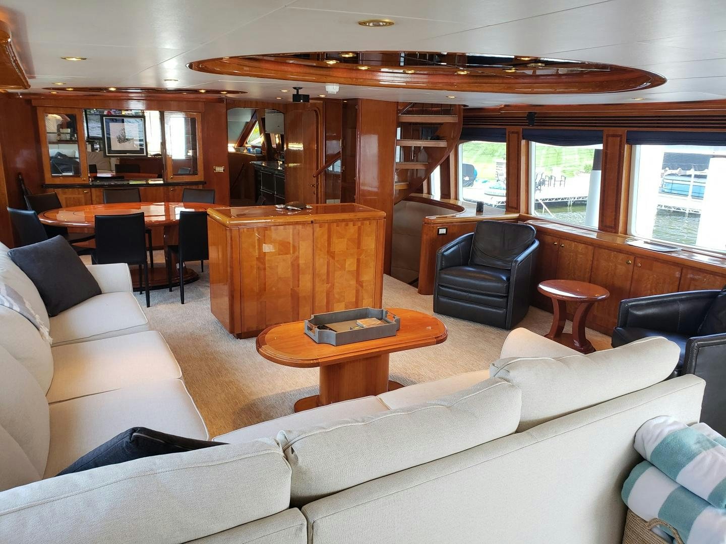 a living room with a table and chairs aboard CRYSTAL ANNE Yacht for Sale