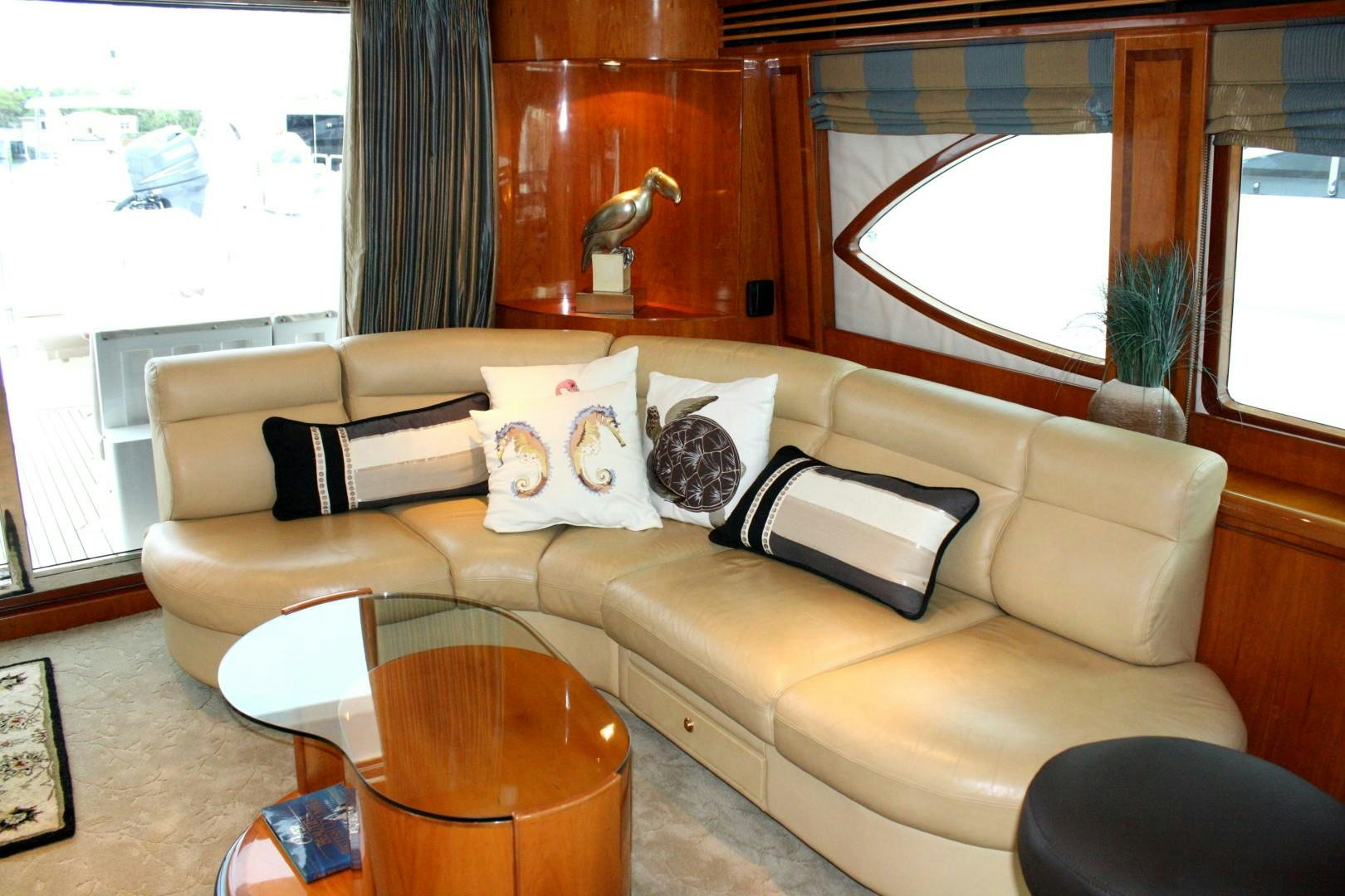 a living room with a couch and a window aboard CRYSTAL ANNE Yacht for Sale