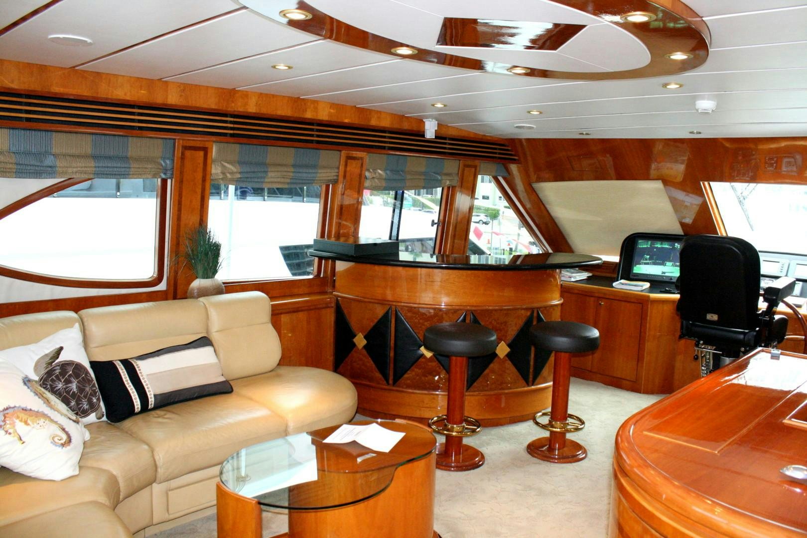 a living room with a piano and a large window aboard CRYSTAL ANNE Yacht for Sale