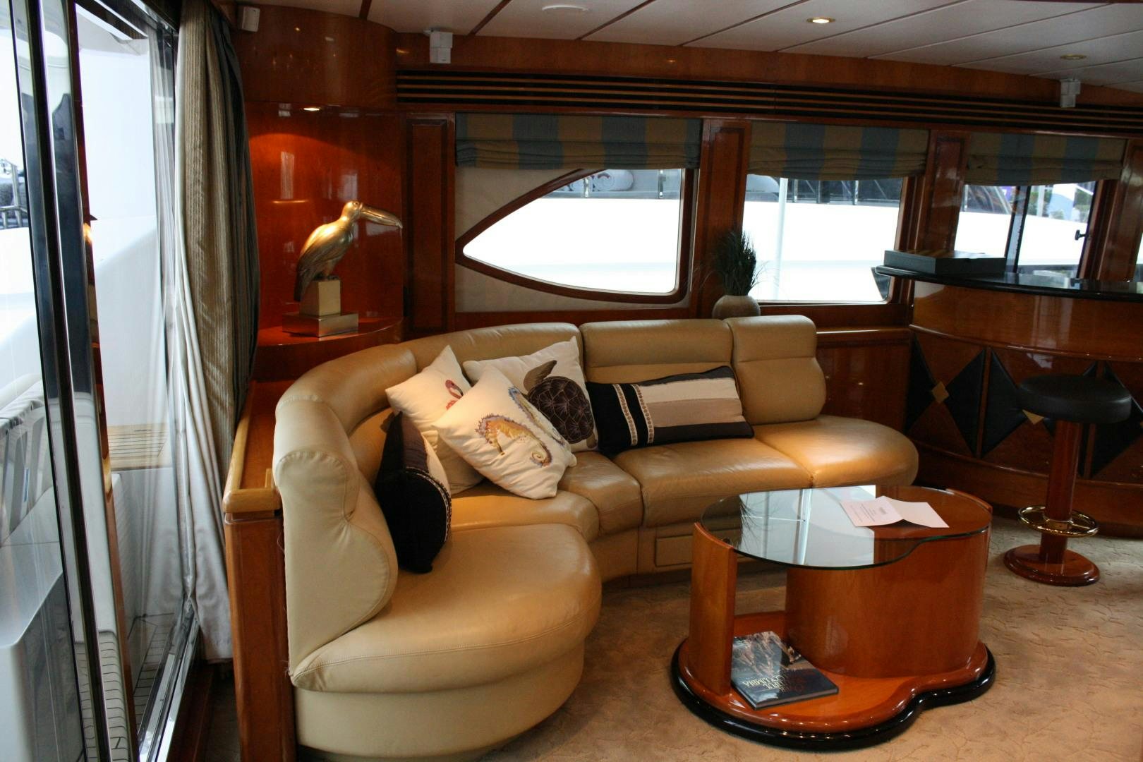 a living room with a couch and a coffee table aboard CRYSTAL ANNE Yacht for Sale