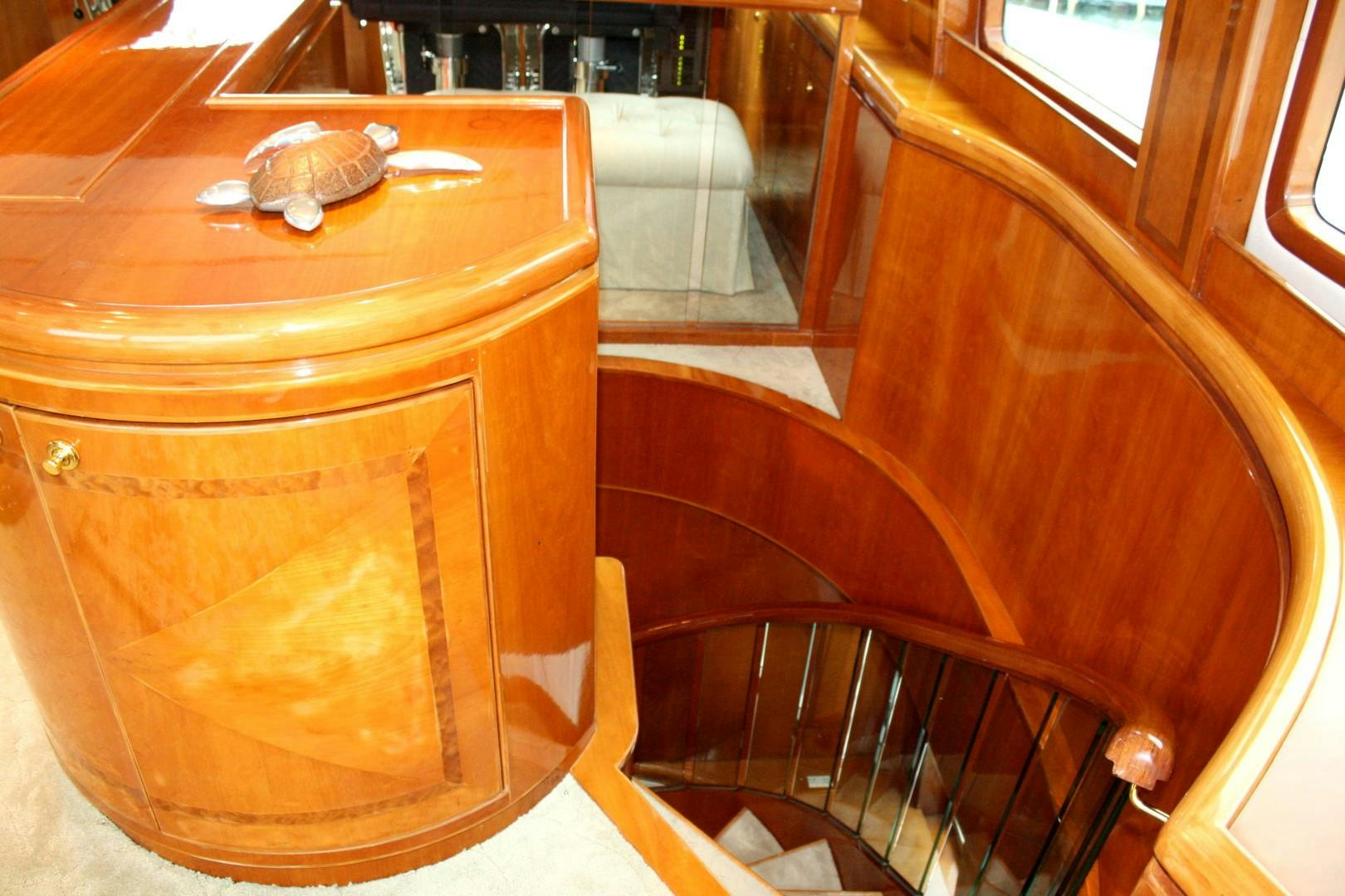 a wooden table with a chair aboard CRYSTAL ANNE Yacht for Sale