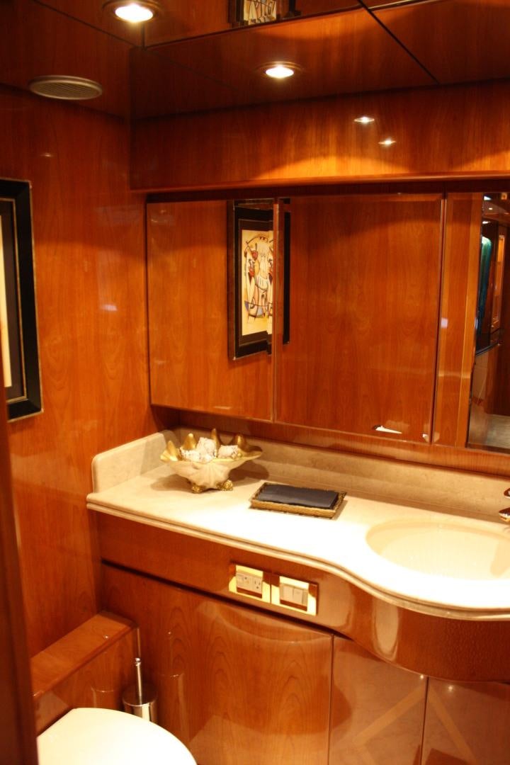 a bathroom with a large mirror aboard CRYSTAL ANNE Yacht for Sale