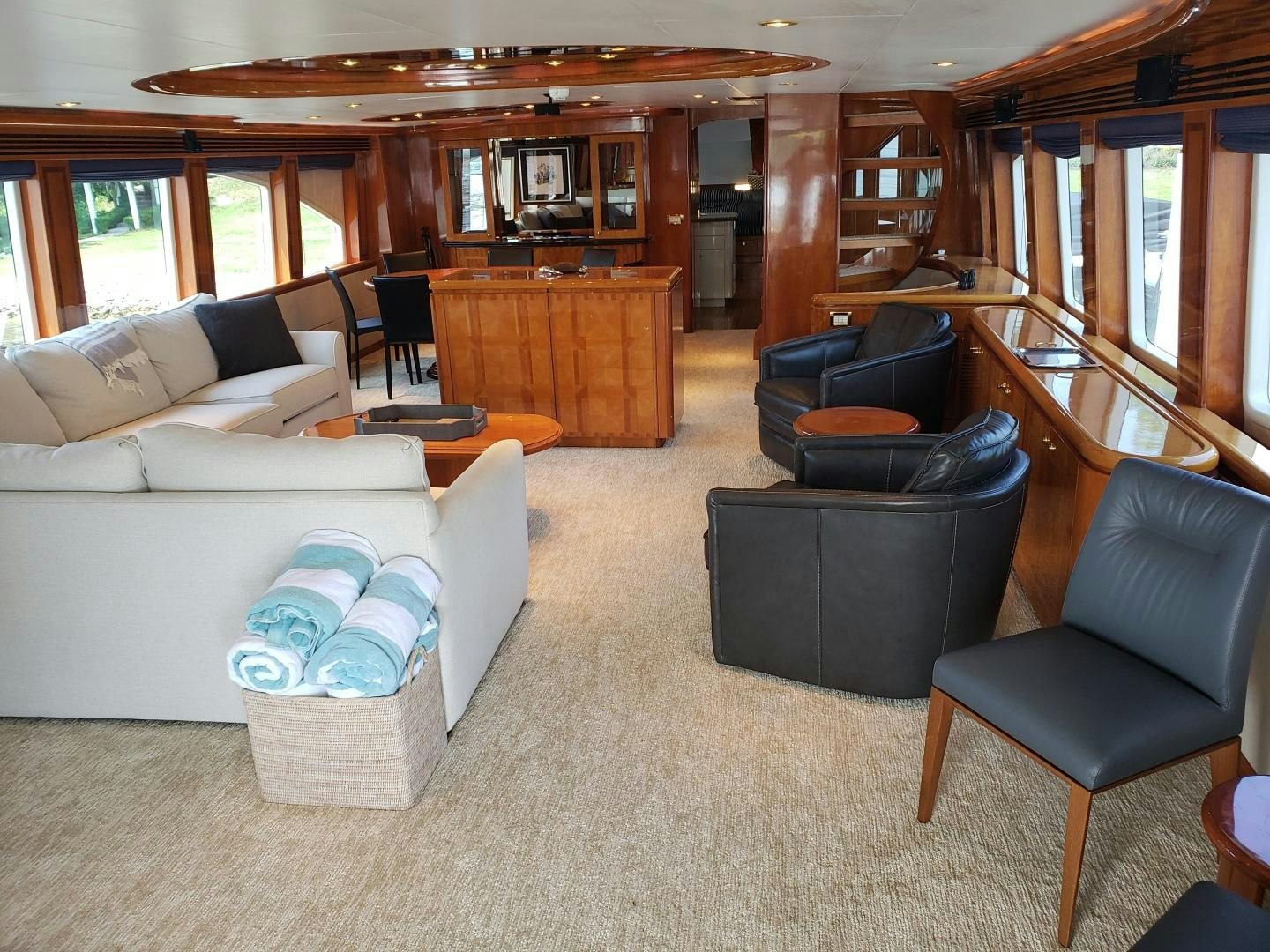 a living room with a couch and a piano aboard CRYSTAL ANNE Yacht for Sale