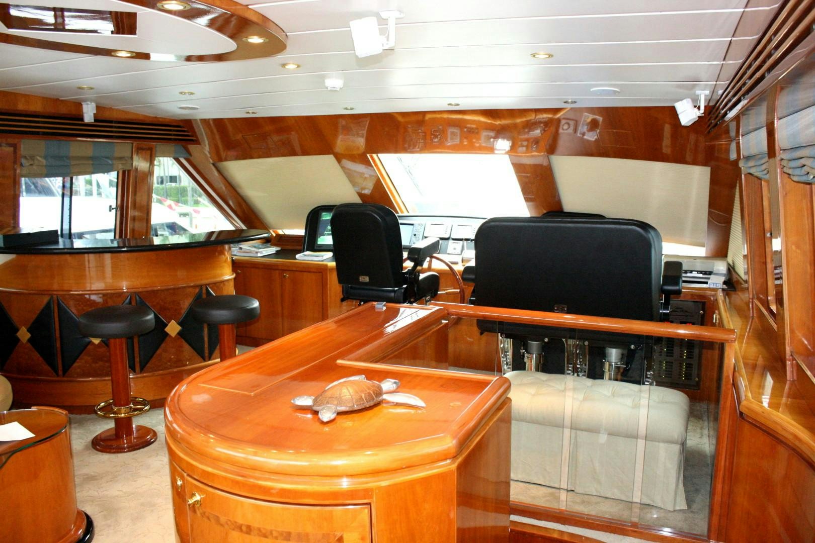 a room with a table and chairs aboard CRYSTAL ANNE Yacht for Sale