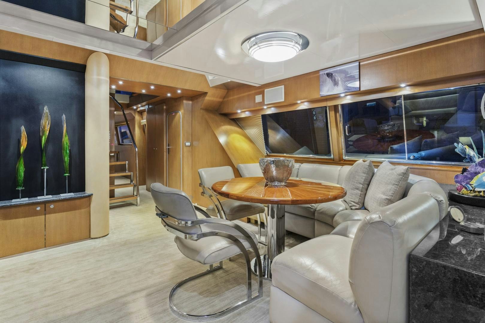 a room with a table and chairs aboard THE FLYING DUTCHMAN Yacht for Sale