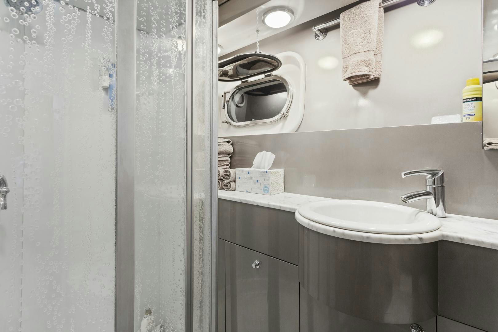 a bathroom with a sink and a mirror aboard THE FLYING DUTCHMAN Yacht for Sale