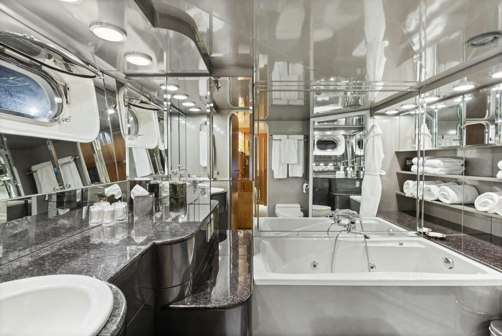 a bathroom with a large mirror aboard THE FLYING DUTCHMAN Yacht for Sale