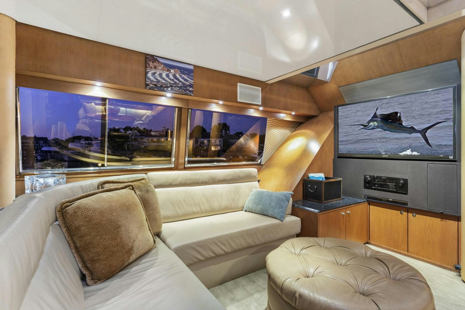a living room with a large screen aboard THE FLYING DUTCHMAN Yacht for Sale