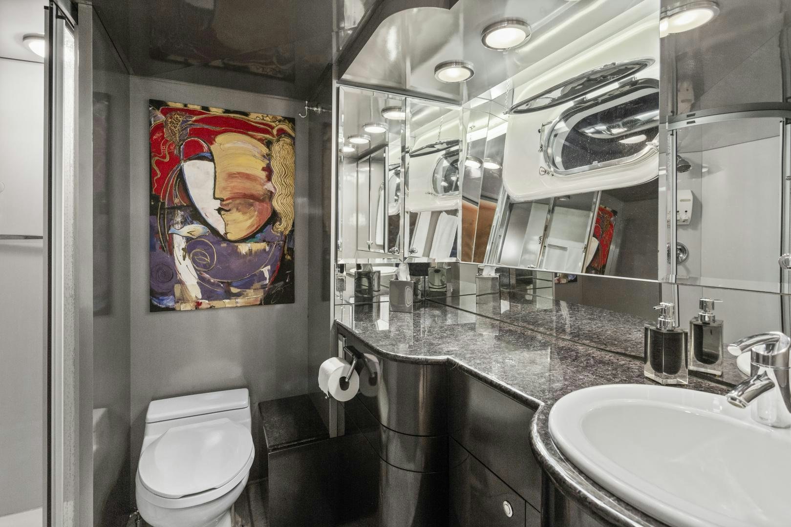 a bathroom with a large mirror aboard THE FLYING DUTCHMAN Yacht for Sale
