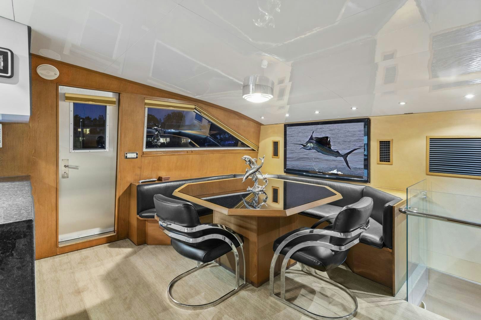 a room with a table and chairs aboard THE FLYING DUTCHMAN Yacht for Sale