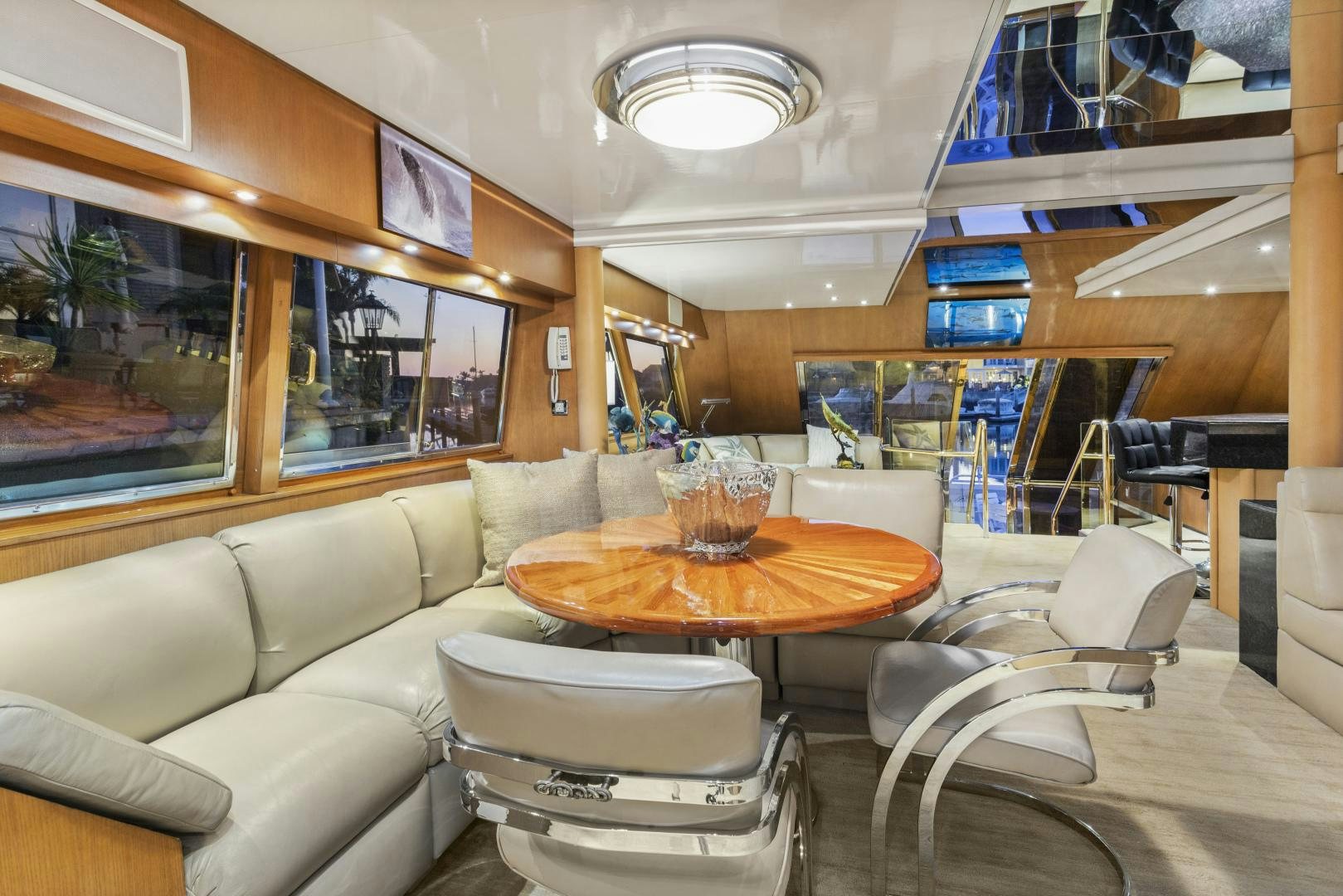 a living room with a table and chairs aboard THE FLYING DUTCHMAN Yacht for Sale