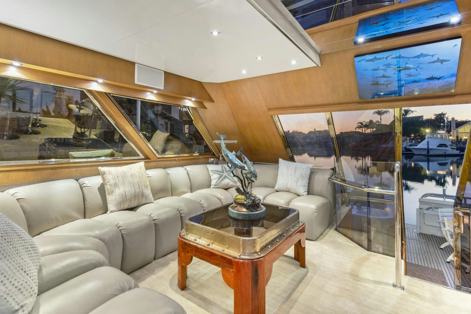 a living room with a large glass wall aboard THE FLYING DUTCHMAN Yacht for Sale