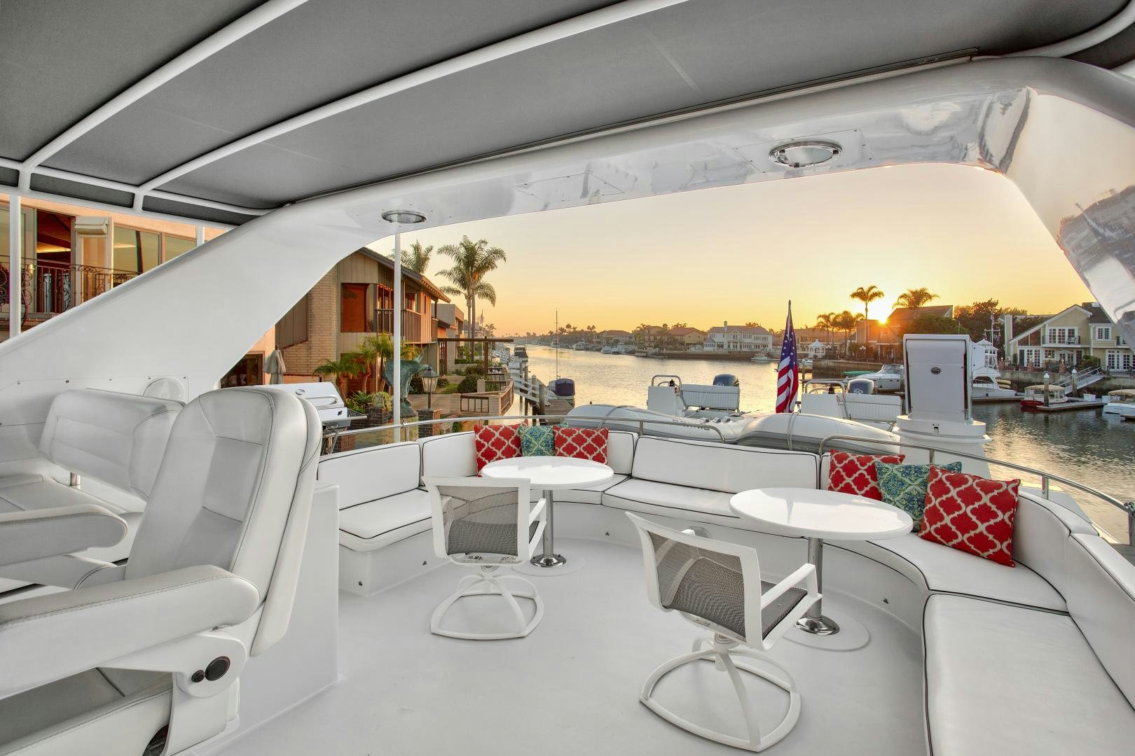 a lounge area with chairs and tables aboard THE FLYING DUTCHMAN Yacht for Sale