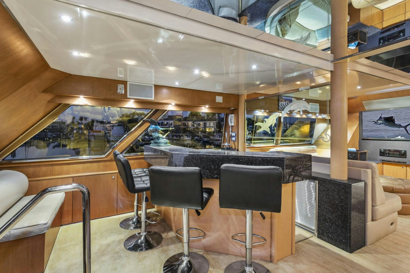 a room with chairs and tables aboard THE FLYING DUTCHMAN Yacht for Sale