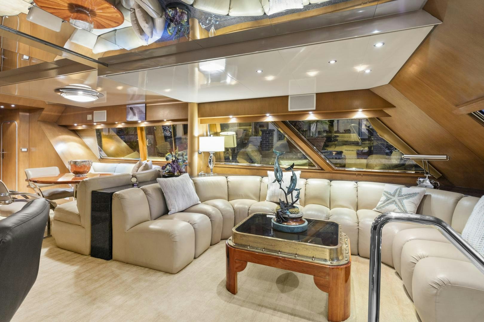 a room with a couch and a table aboard THE FLYING DUTCHMAN Yacht for Sale