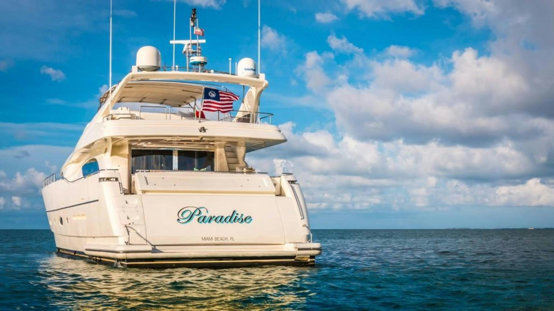 a large white boat in the water aboard PARADISE Yacht for Sale