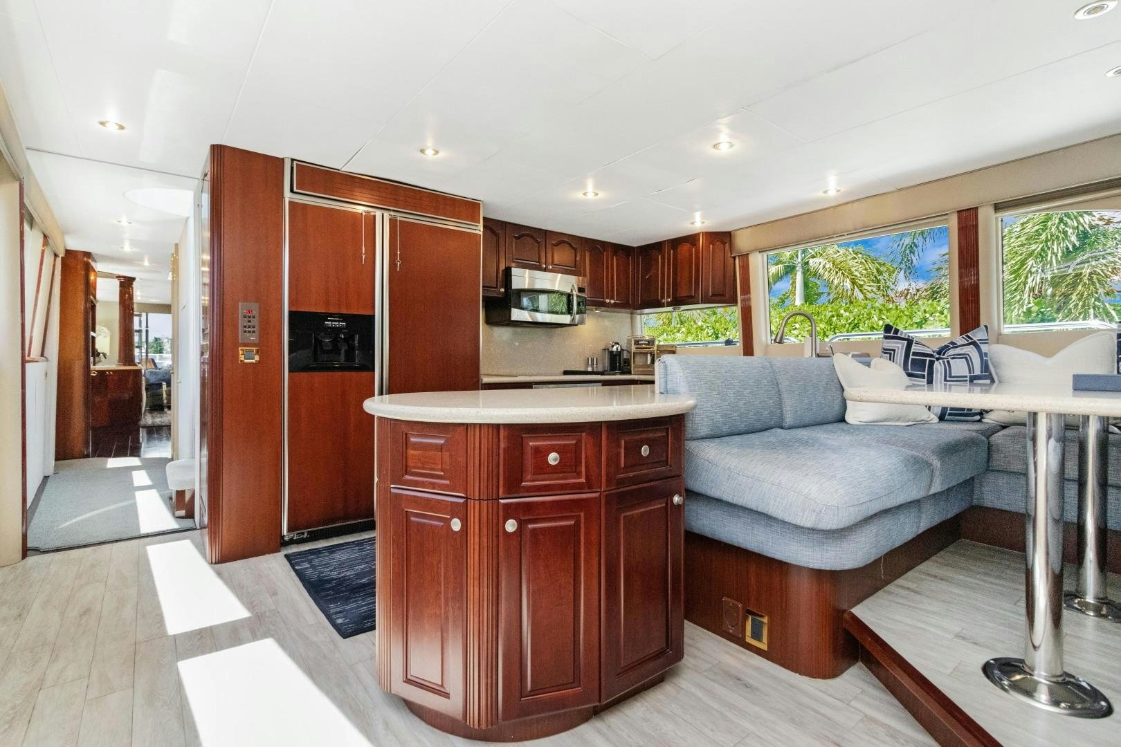 a kitchen with a couch and a table aboard SUZANNE Yacht for Sale
