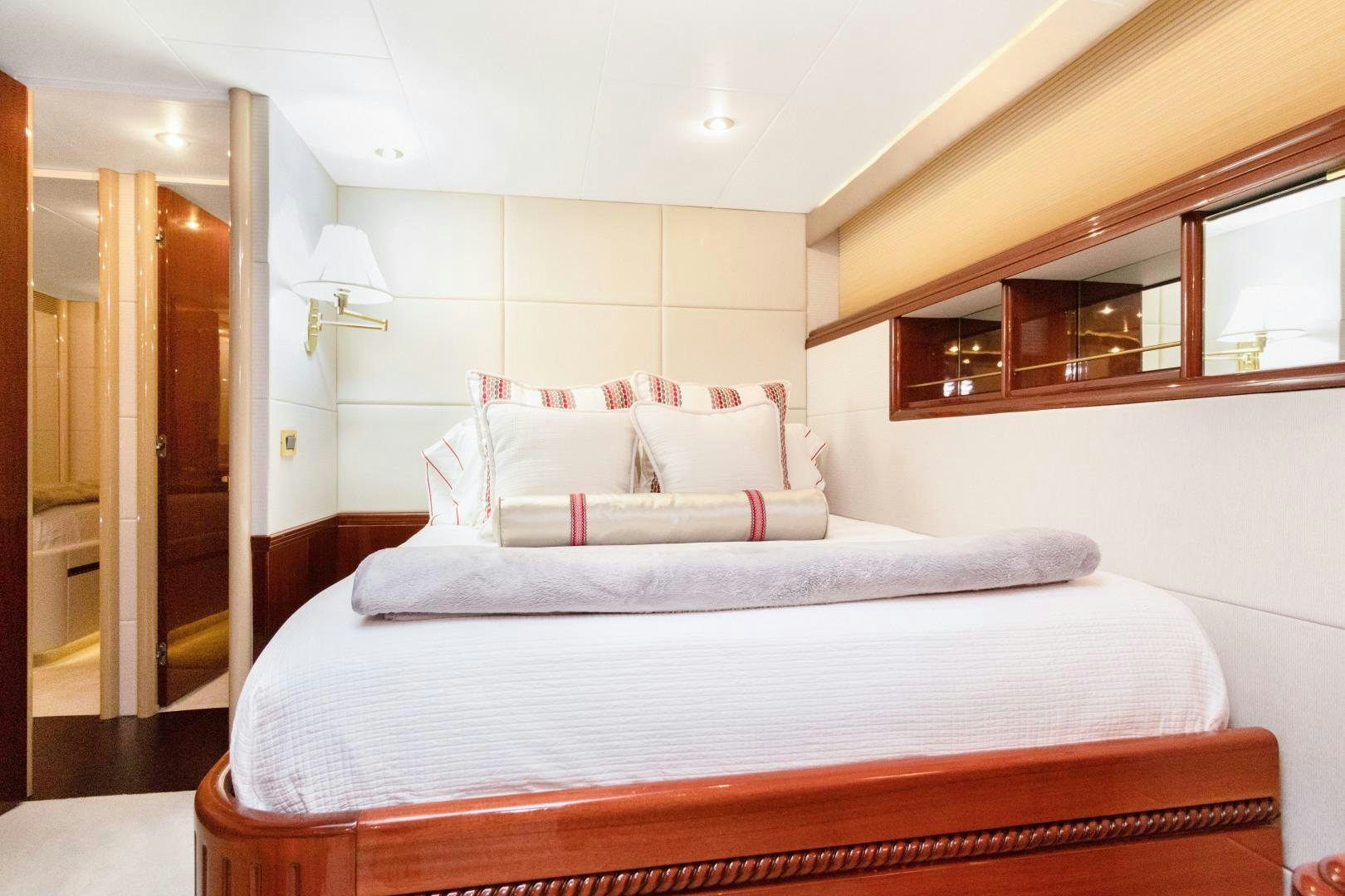 a bed with white sheets aboard SUZANNE Yacht for Sale