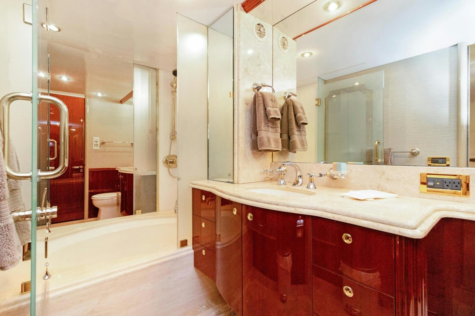 a bathroom with a large mirror aboard SUZANNE Yacht for Sale