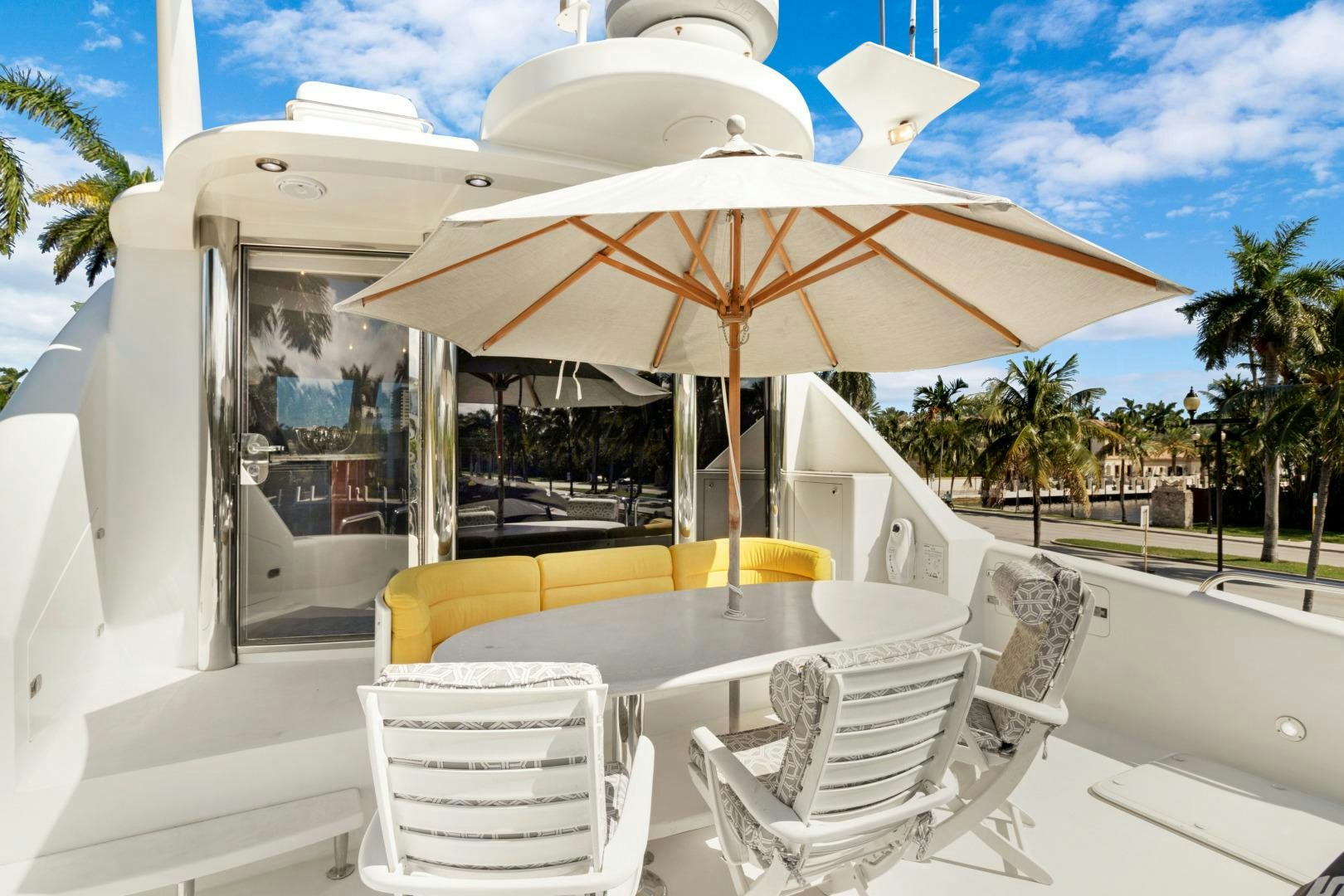 a table and chairs outside a building aboard SUZANNE Yacht for Sale