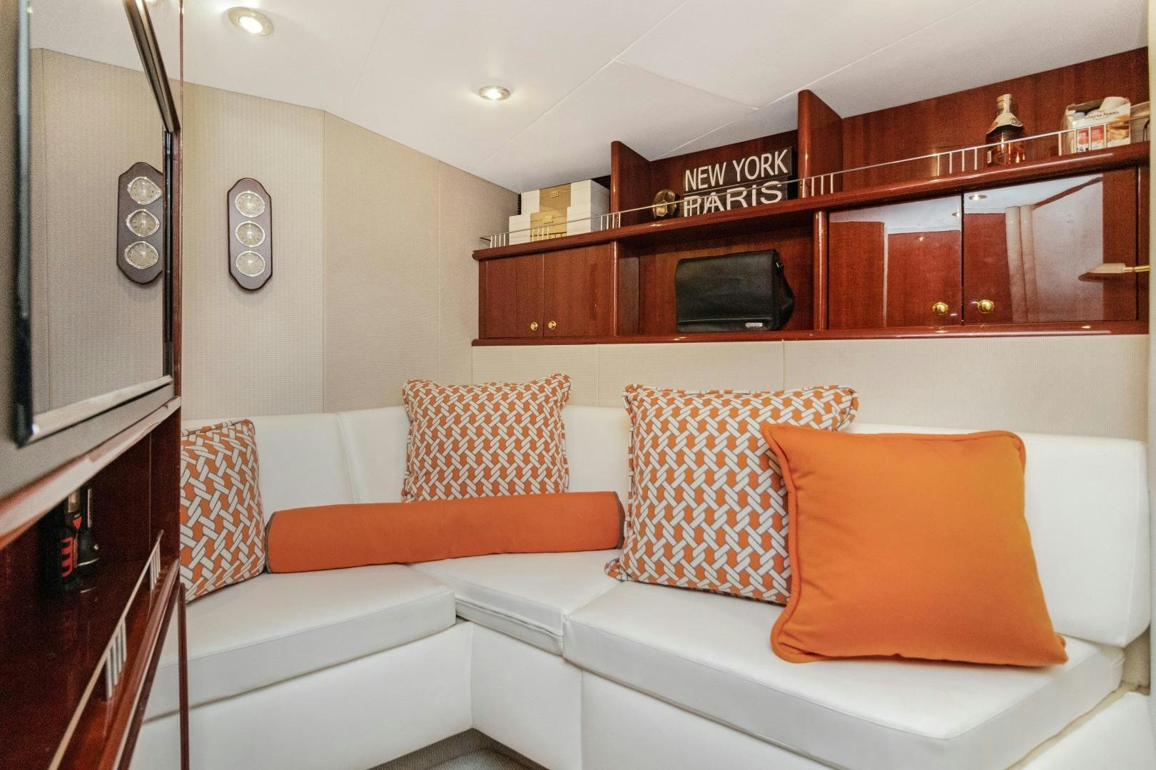 a living room with a white couch aboard SUZANNE Yacht for Sale