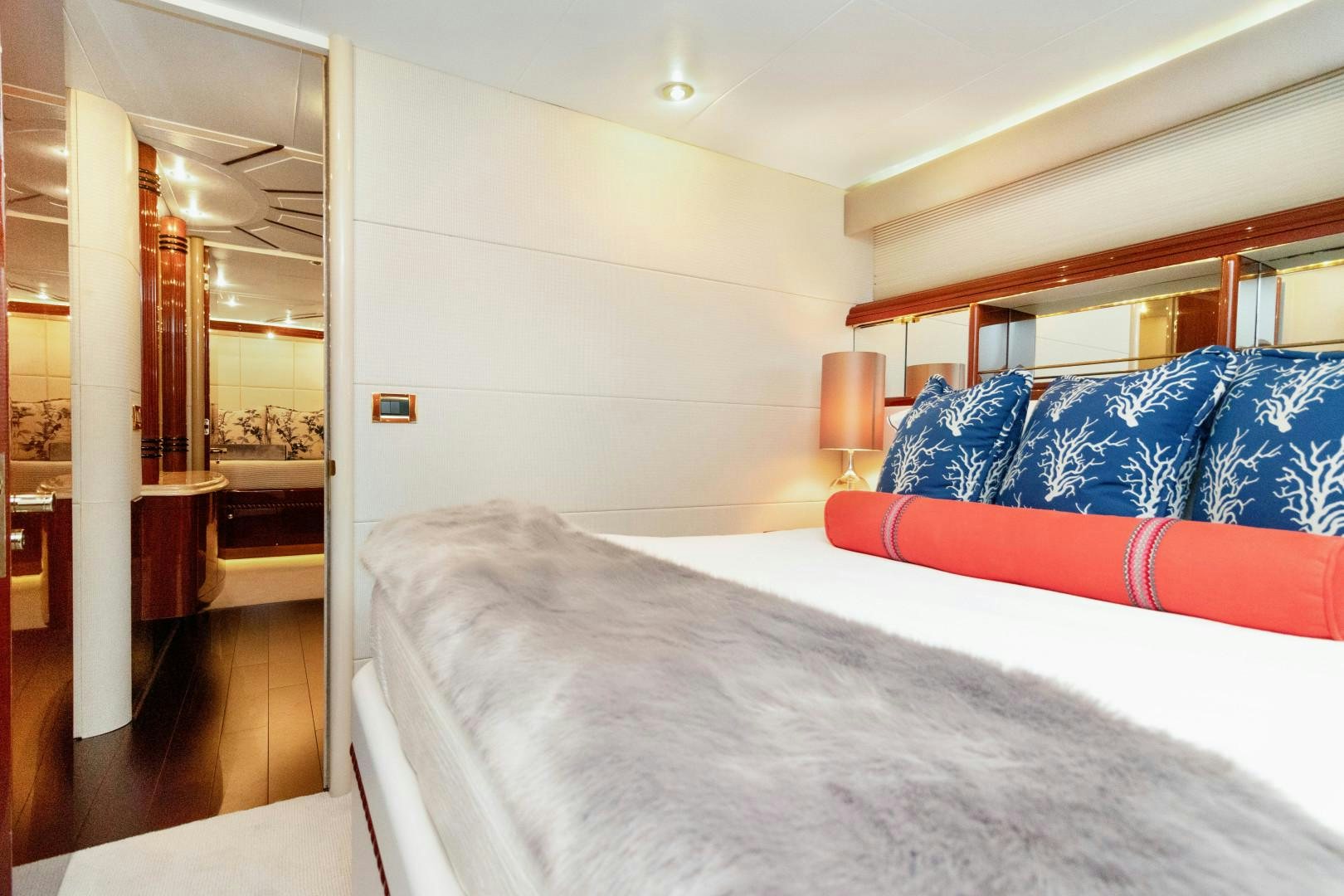 a bedroom with a bed and a desk aboard SUZANNE Yacht for Sale