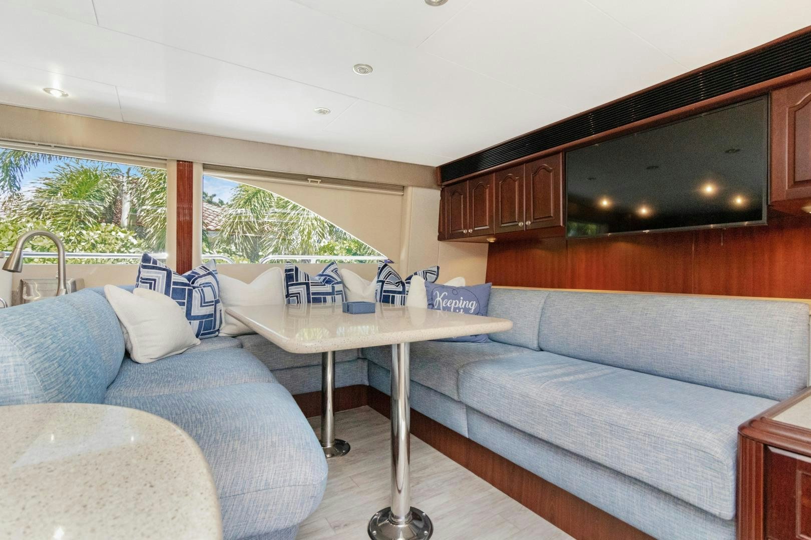 a living room with a couch and a television aboard SUZANNE Yacht for Sale