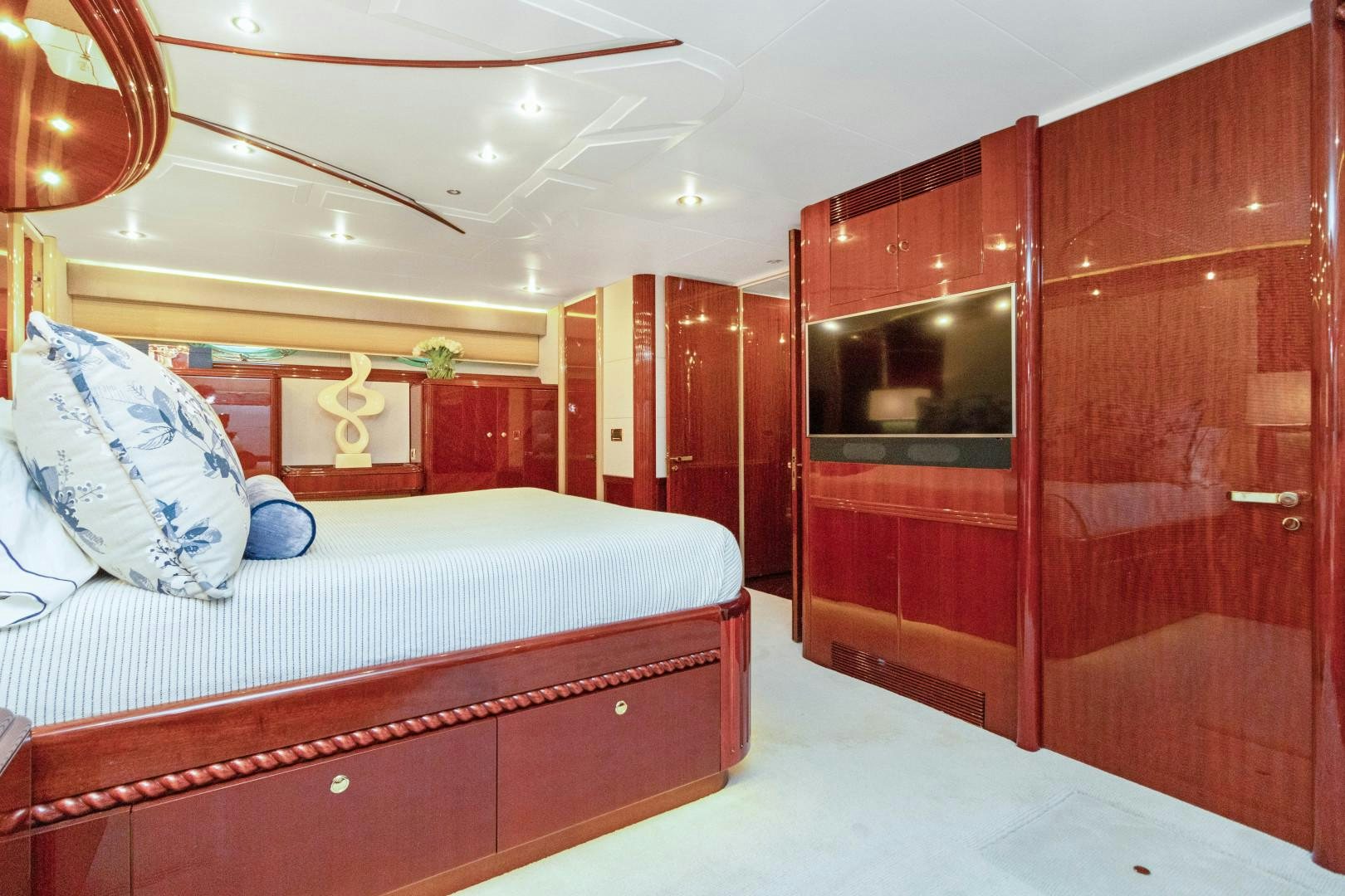 a room with a bed and a mirror aboard SUZANNE Yacht for Sale