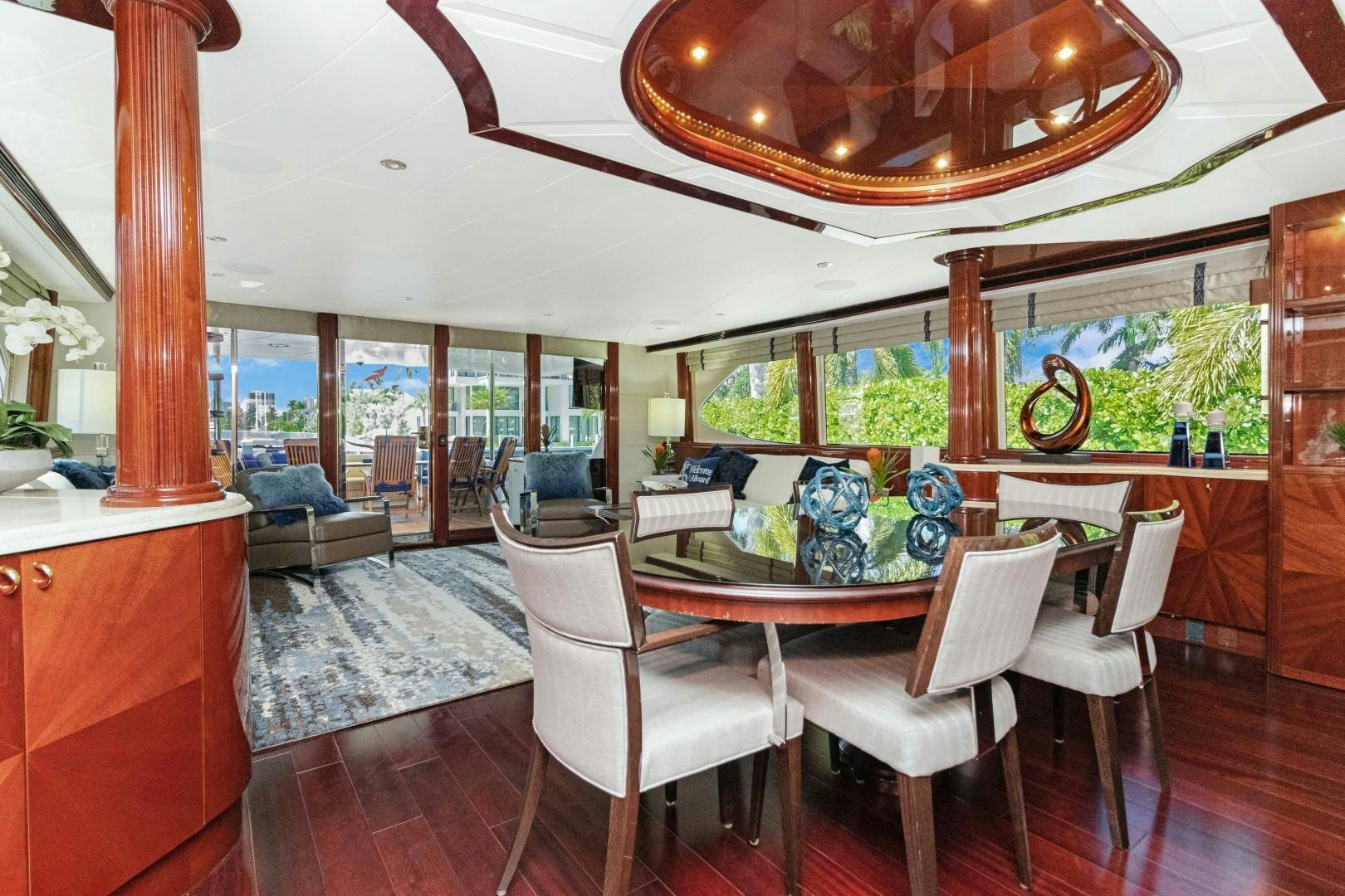 a dining room with a table and chairs aboard SUZANNE Yacht for Sale