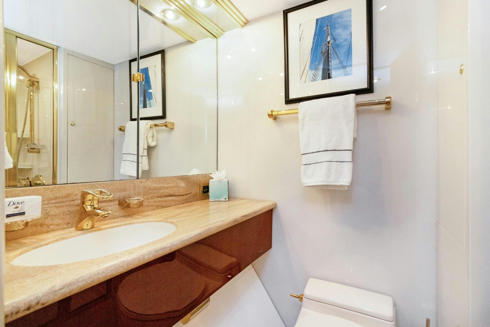 a bathroom with a sink and a mirror aboard SUZANNE Yacht for Sale