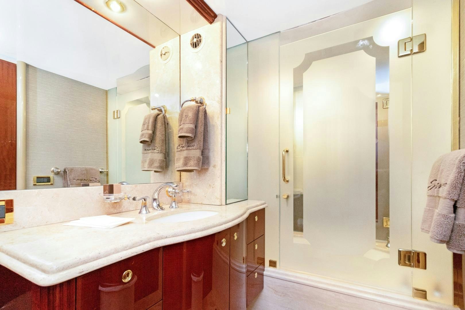 a bathroom with a standup shower aboard SUZANNE Yacht for Sale