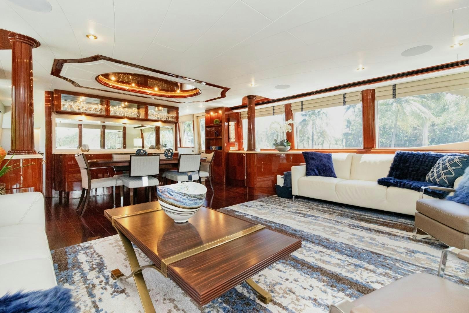 a living room with a large window aboard SUZANNE Yacht for Sale