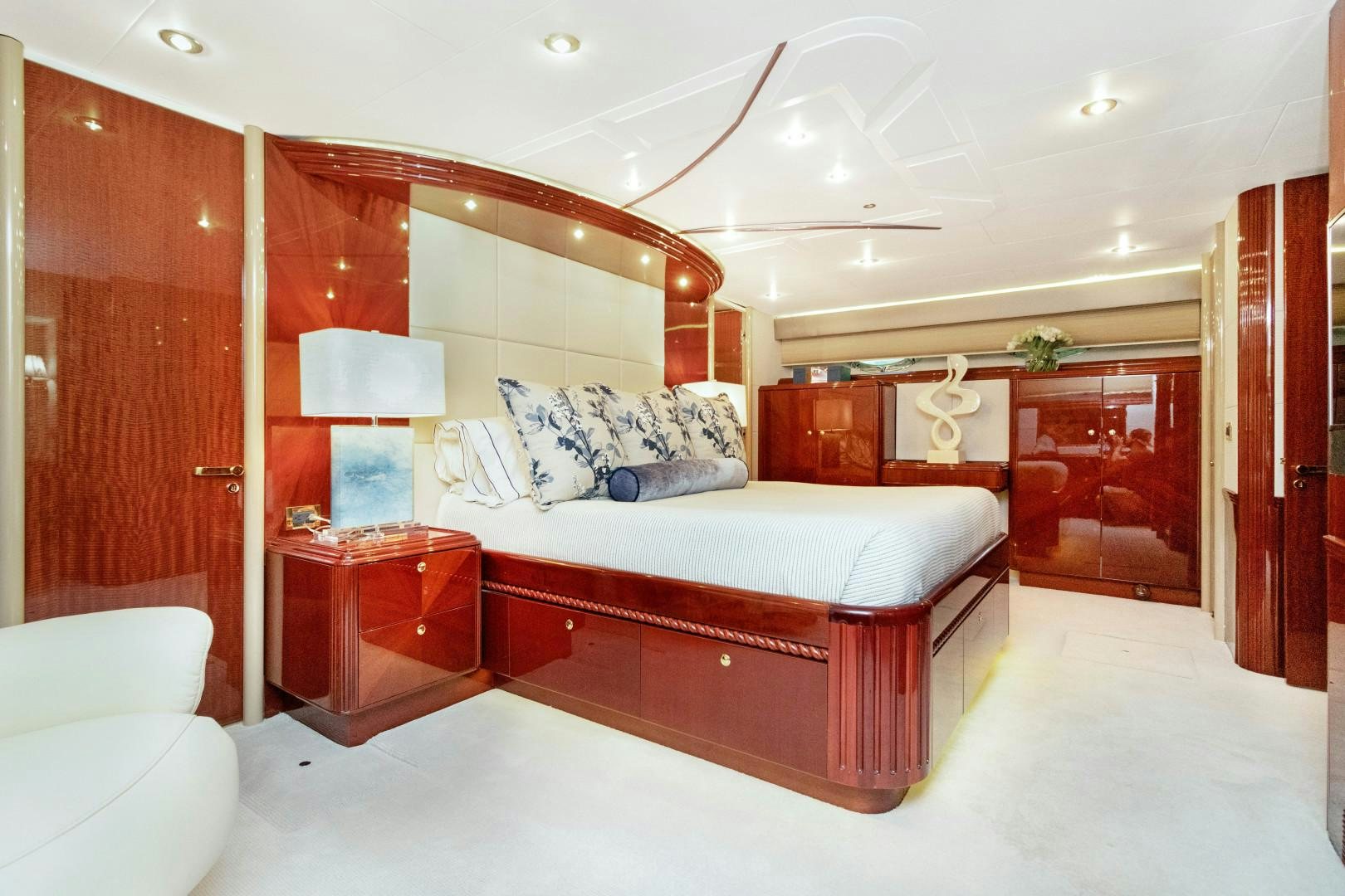 a bedroom with a bed and a desk aboard SUZANNE Yacht for Sale