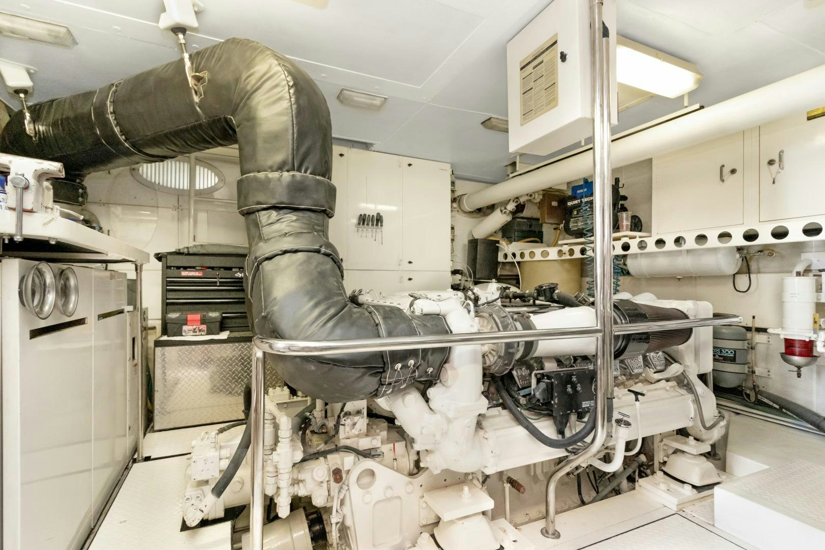 a person working on a machine aboard SUZANNE Yacht for Sale