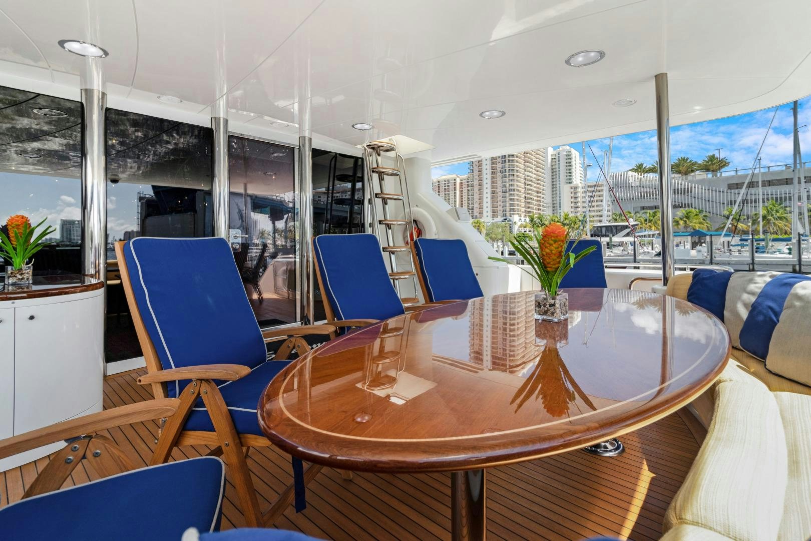 a table with chairs and a window aboard SUZANNE Yacht for Sale